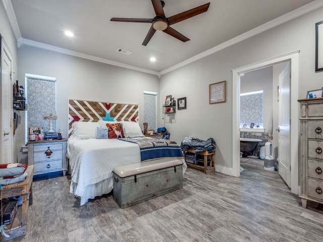 bedroom with ensuite bath, ceiling fan, hardwood / wood-style flooring, and crown molding