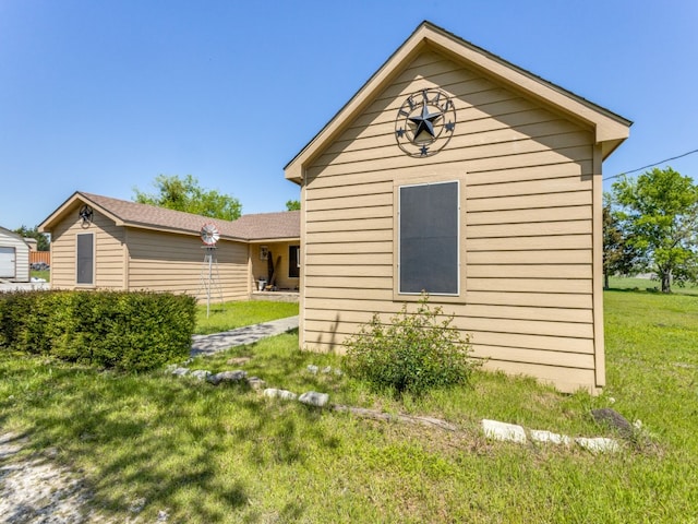 view of property exterior featuring a lawn