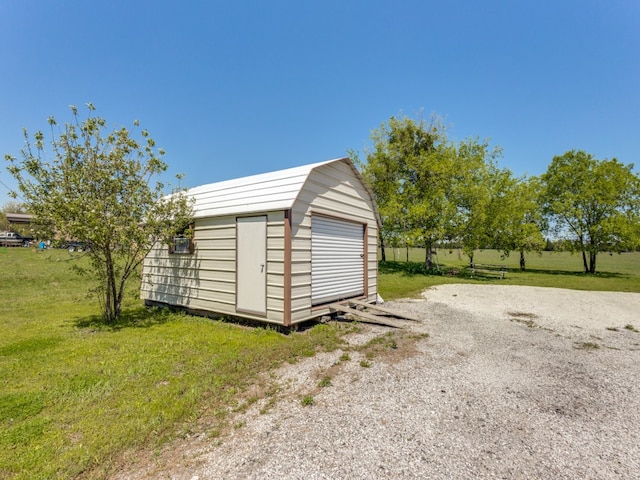 view of shed / structure with a yard