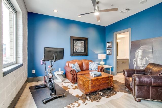 living room with visible vents, recessed lighting, a ceiling fan, and wood finished floors