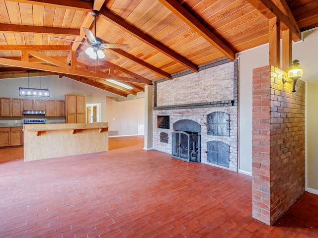 unfurnished living room with brick wall, a brick fireplace, ceiling fan, wooden ceiling, and high vaulted ceiling