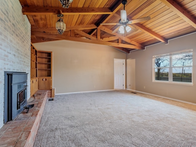 unfurnished living room featuring ceiling fan, wooden ceiling, and a brick fireplace