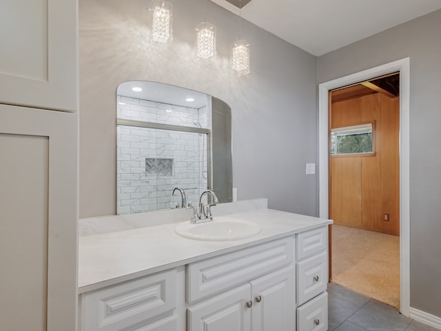 bathroom with tile floors and vanity