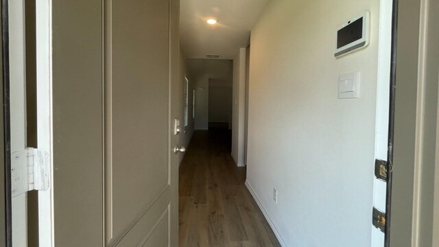 hallway featuring hardwood / wood-style floors