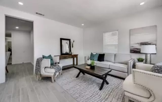 living room with light hardwood / wood-style floors