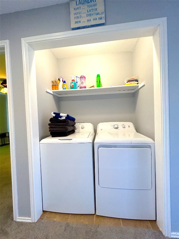 laundry area with independent washer and dryer