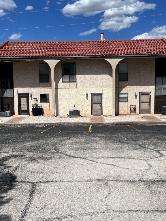 view of building exterior featuring central AC