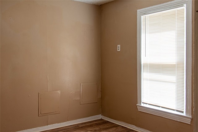 empty room featuring dark wood-type flooring