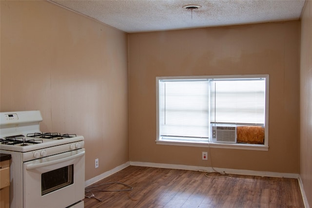 kitchen with a textured ceiling, white range with gas cooktop, and dark hardwood / wood-style floors