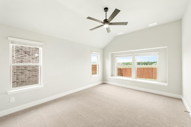 unfurnished room featuring carpet flooring, ceiling fan, and lofted ceiling