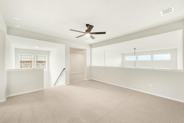 carpeted empty room with ceiling fan