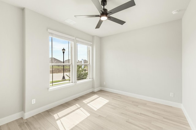 unfurnished room with light hardwood / wood-style flooring and ceiling fan