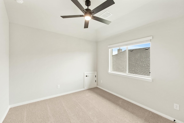 carpeted empty room with ceiling fan