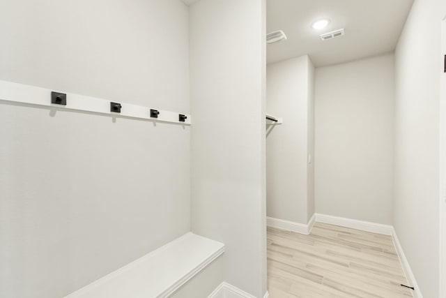 mudroom with light hardwood / wood-style flooring