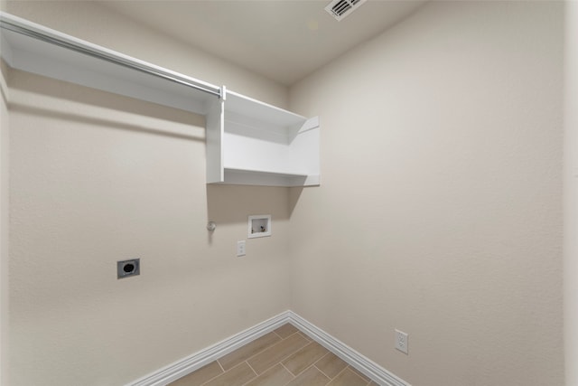 laundry area with hookup for a washing machine, tile patterned floors, electric dryer hookup, and hookup for a gas dryer