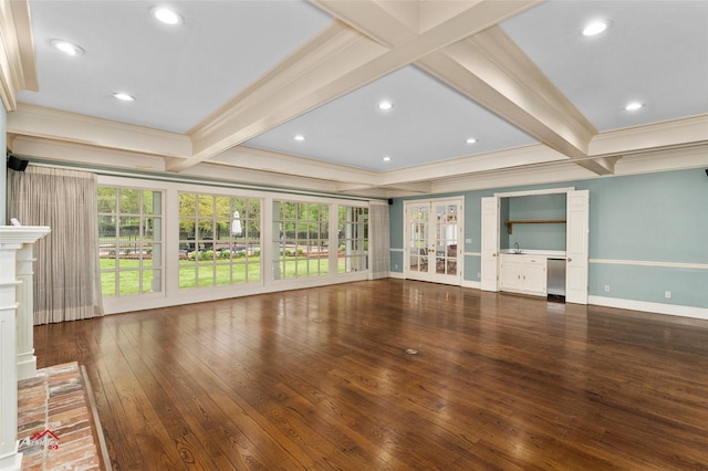 unfurnished living room with beamed ceiling, ornamental molding, dark hardwood / wood-style flooring, french doors, and a fireplace