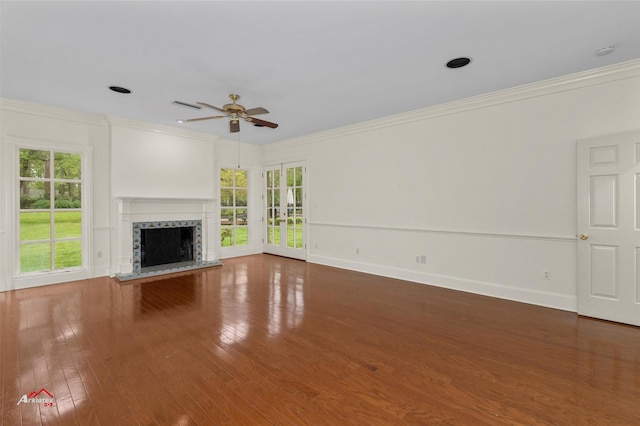 unfurnished living room with ceiling fan, crown molding, hardwood / wood-style floors, and a high end fireplace