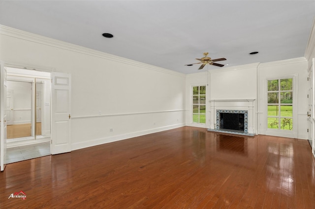 unfurnished living room with ornamental molding, ceiling fan, and wood-type flooring