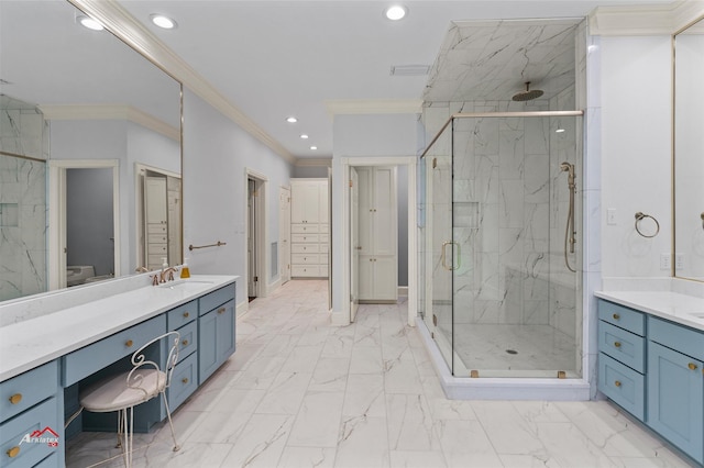 bathroom with ornamental molding, vanity, and a shower with shower door