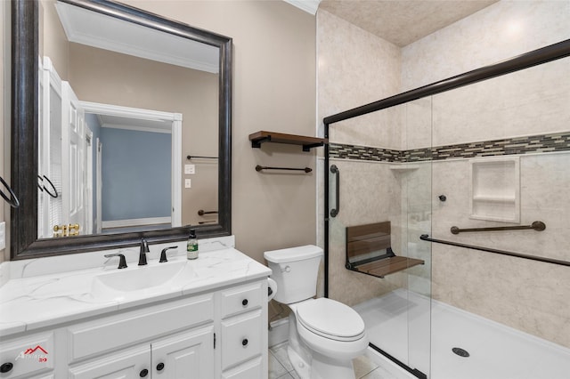 bathroom featuring toilet, tile patterned flooring, a shower with door, crown molding, and vanity