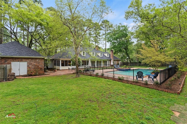 exterior space featuring a yard, a sunroom, and a patio area