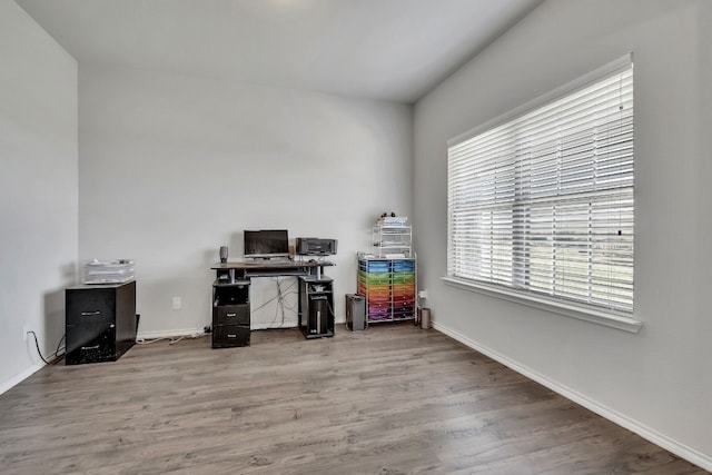 office with light hardwood / wood-style floors