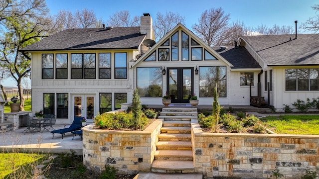 view of front of home featuring a patio area and french doors