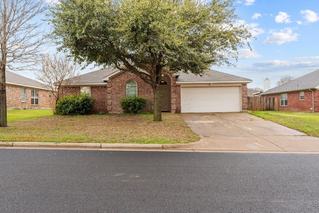 view of front of home with a front lawn and a garage