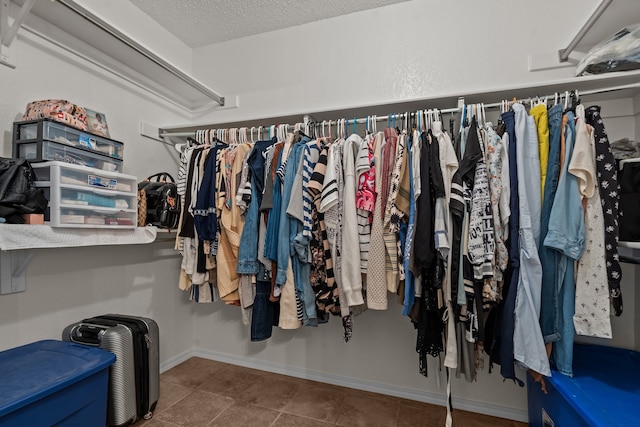 spacious closet with tile patterned flooring