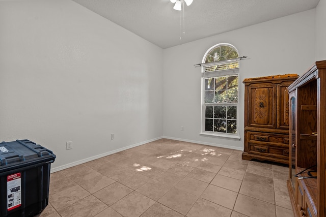 interior space featuring a textured ceiling and ceiling fan