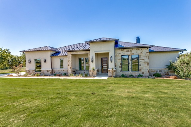 rear view of property featuring a yard