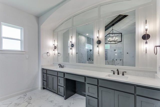 bathroom featuring a chandelier, vanity, and tiled shower