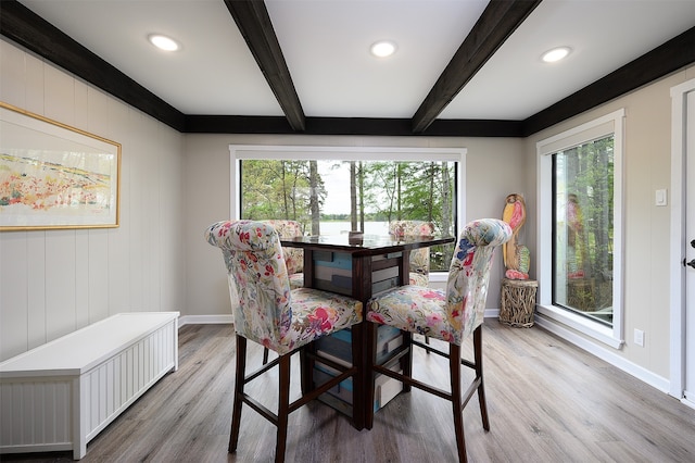 bedroom featuring ornamental molding, ceiling fan, hardwood / wood-style flooring, and multiple windows