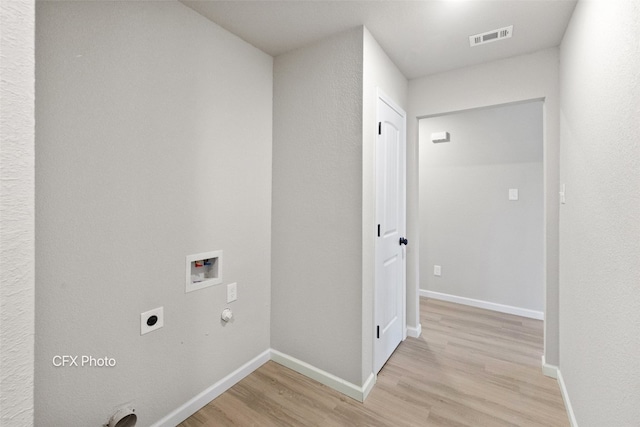 laundry room featuring washer hookup, gas dryer hookup, electric dryer hookup, and light wood-type flooring