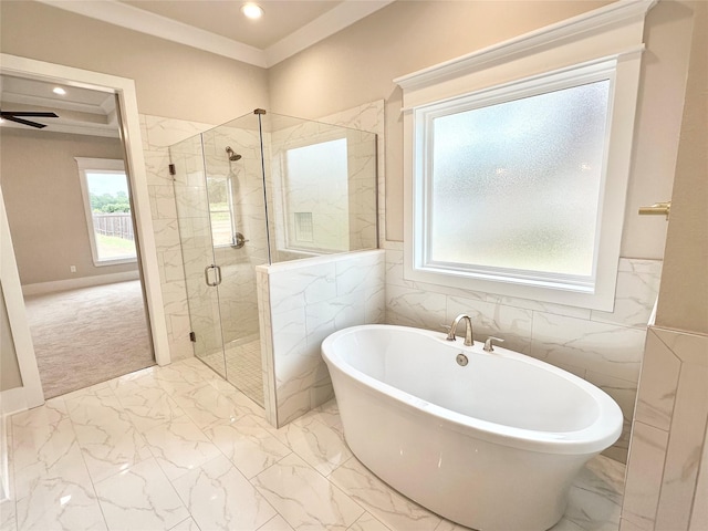 bathroom with crown molding, ceiling fan, and separate shower and tub