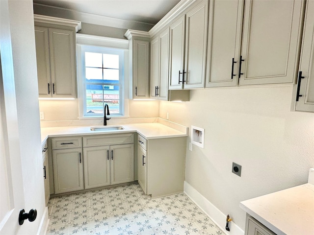 clothes washing area with cabinets, electric dryer hookup, sink, and washer hookup