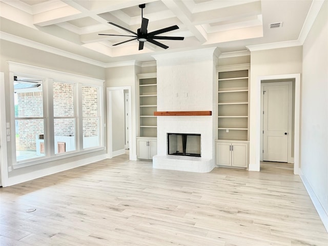 unfurnished living room featuring coffered ceiling, a brick fireplace, light wood-type flooring, ceiling fan, and beam ceiling