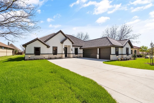 mediterranean / spanish-style house featuring a front lawn and a garage