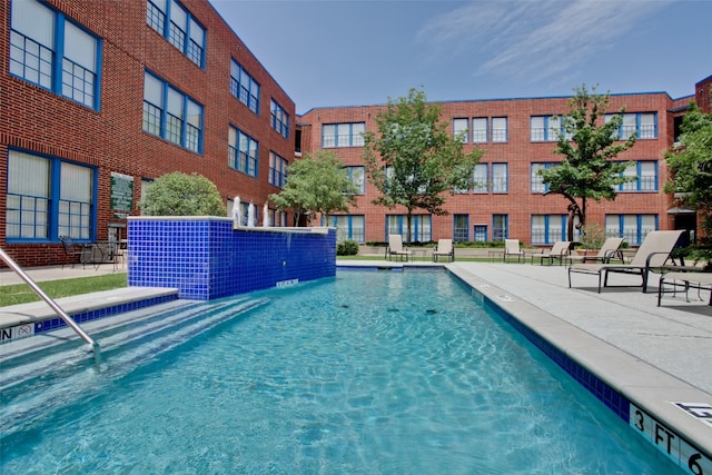 view of pool featuring pool water feature