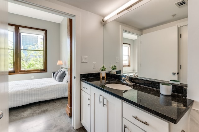 bathroom with a wealth of natural light and vanity