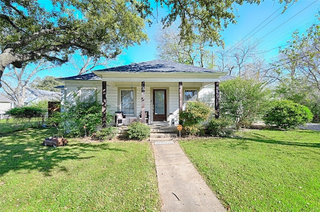 bungalow with a porch and a front yard