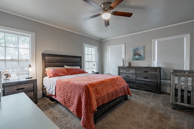 carpeted bedroom featuring crown molding and ceiling fan