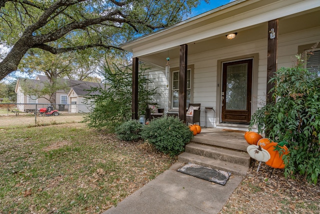 doorway to property featuring covered porch