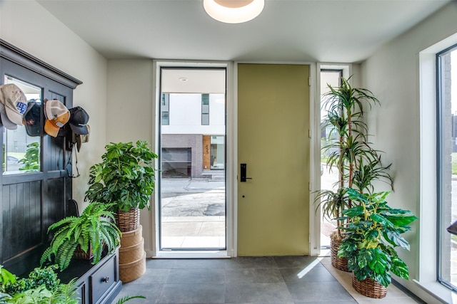 doorway to outside featuring floor to ceiling windows