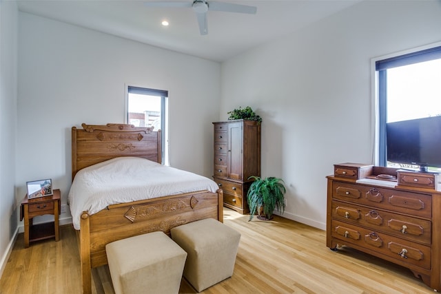 bedroom with light wood finished floors, ceiling fan, baseboards, and recessed lighting