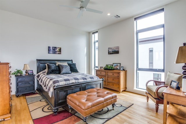 bedroom featuring a ceiling fan, recessed lighting, visible vents, and light wood-style floors