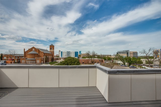 wooden deck with a view of city