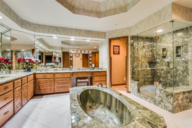 bathroom with tile patterned flooring, a garden tub, toilet, double vanity, and a stall shower