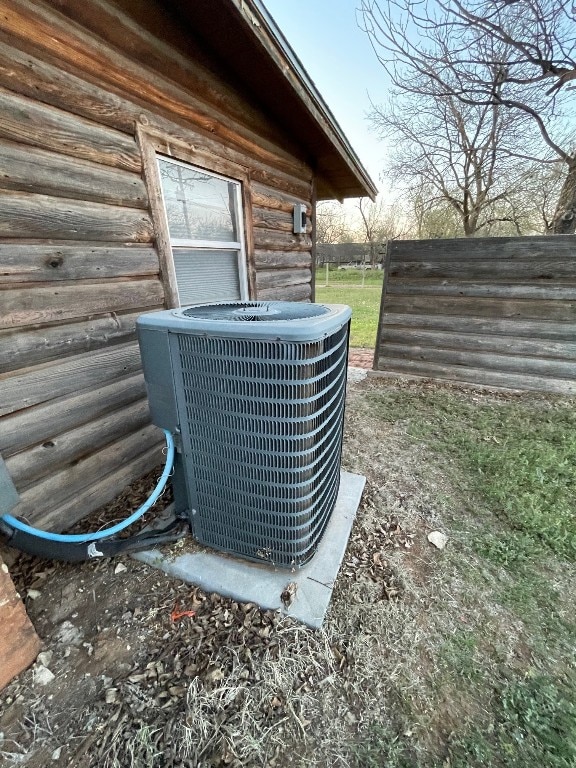 details with log walls and central AC unit