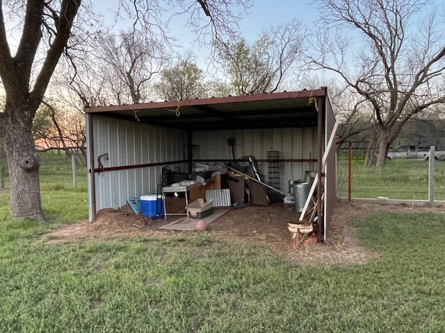 view of outdoor structure featuring a lawn